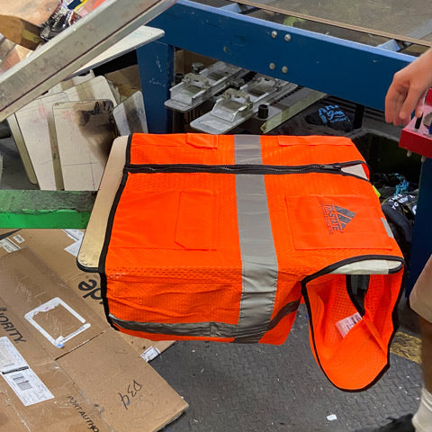 safety orange vest being custom printed