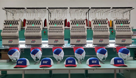 baseball caps coming off embroidery machines