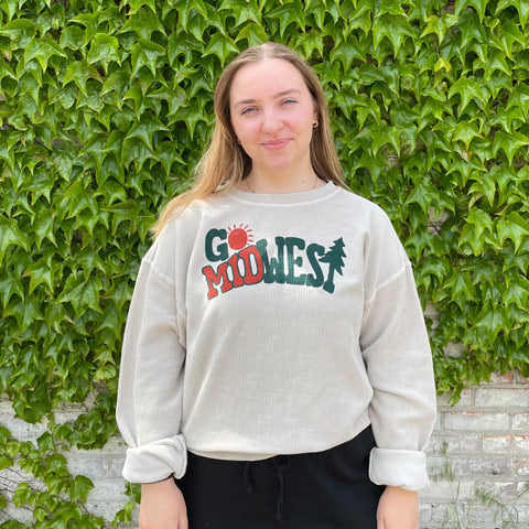woman in ‘Go Midwest’ corded sweatshirt