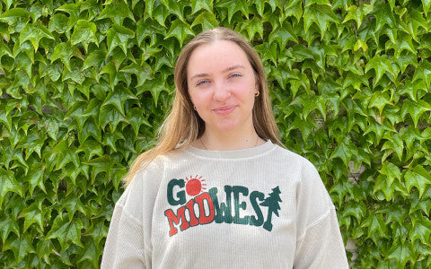 young woman in white “Go Midwest” crew sweatshirt from fancysweetstx