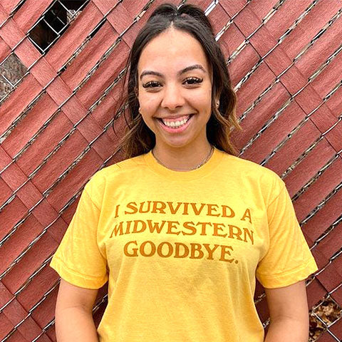 model with a yellow printed fancysweetstx t-shirt