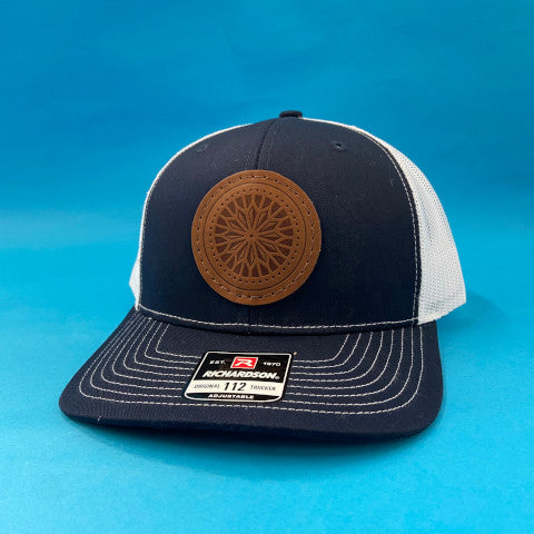 hat with embroidered leather patch