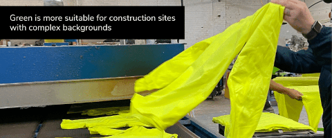green is more suitable for construction sites with complex backgrounds