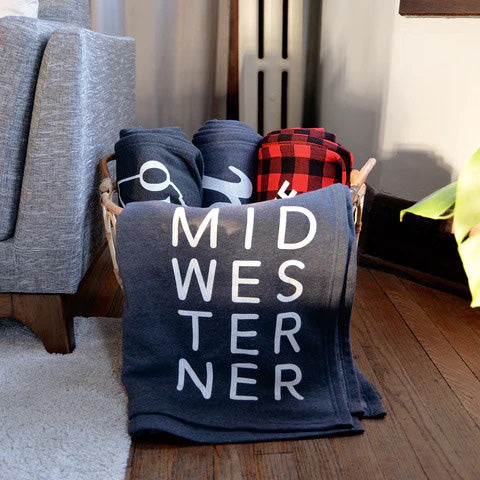 fancysweetstx’s sweatshirt blankets in a decor basket