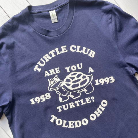 Turtle Club logo on T-shirt