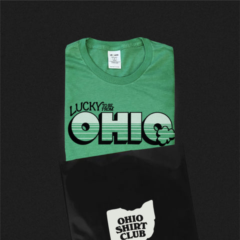 lucky to be from ohio t-shirt being placed in to an ohio shirt club envelope